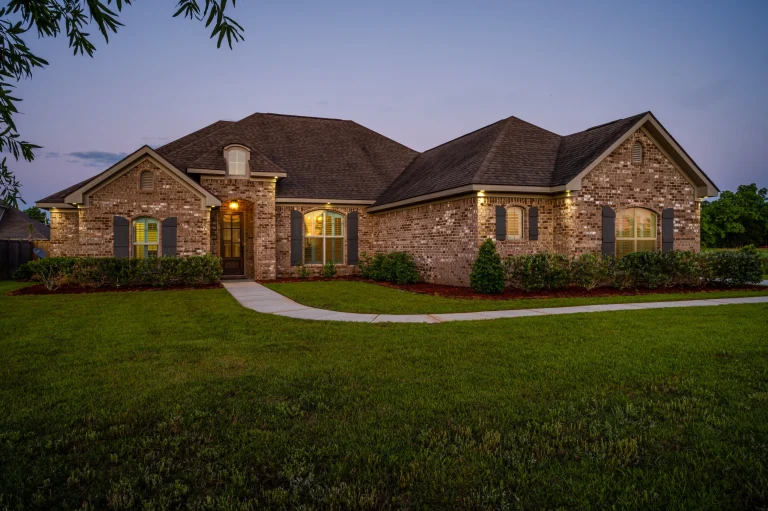 Home 6 A Brick House With A Lawn